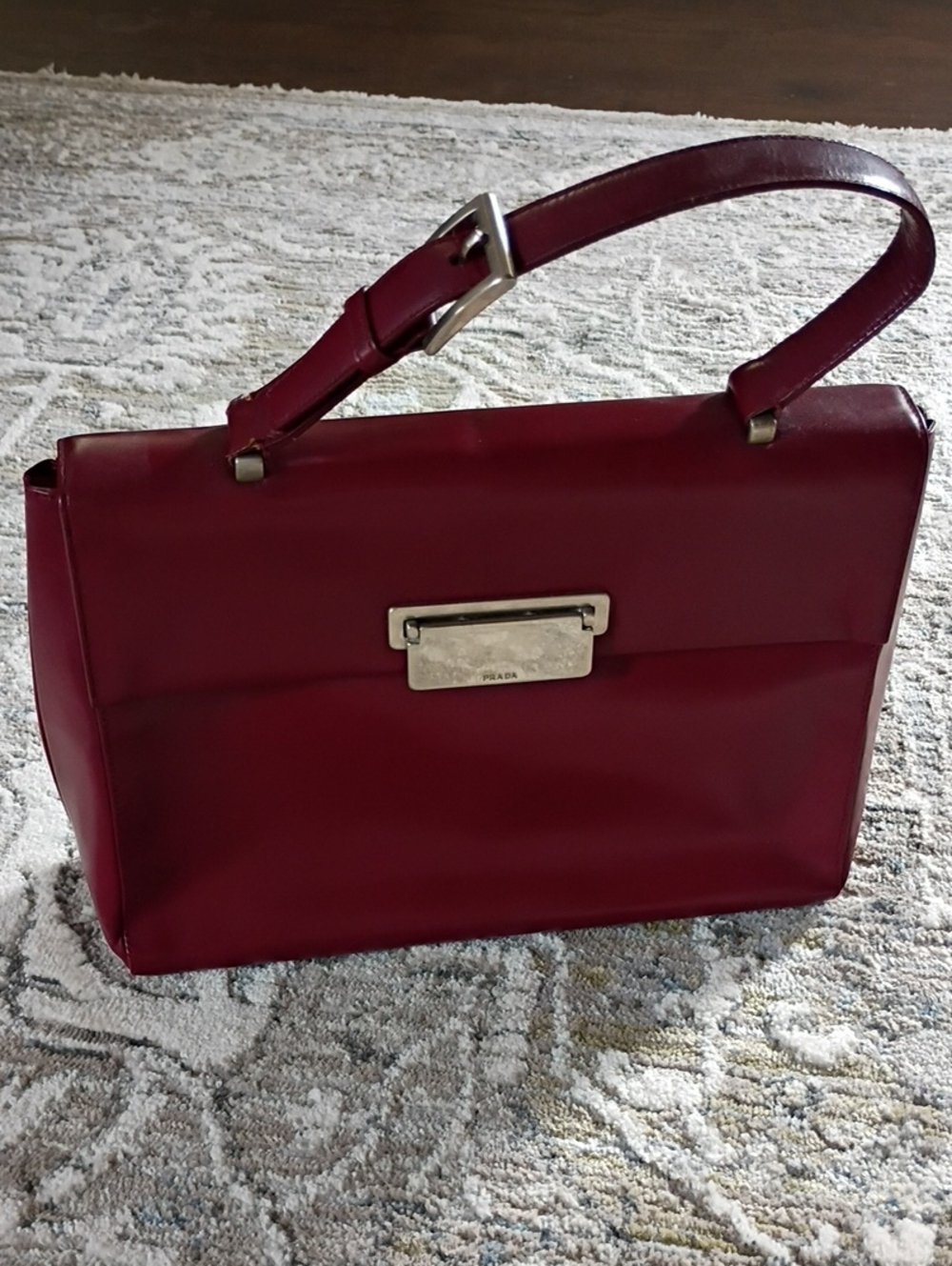 Prada Vitello Lissato Top Handle Bag in a rich Borolo (burgandy)